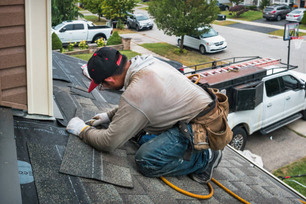 Professional Storm Damage Roof Repair technician working in Sayville, NY